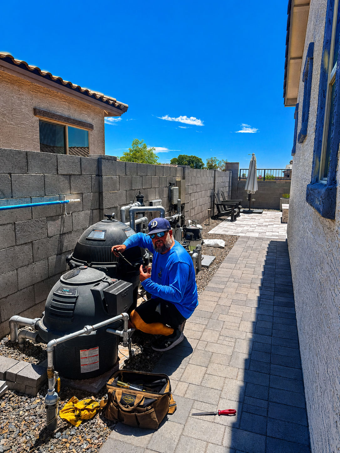 Burro Pools technician repairing high-end pool equipment